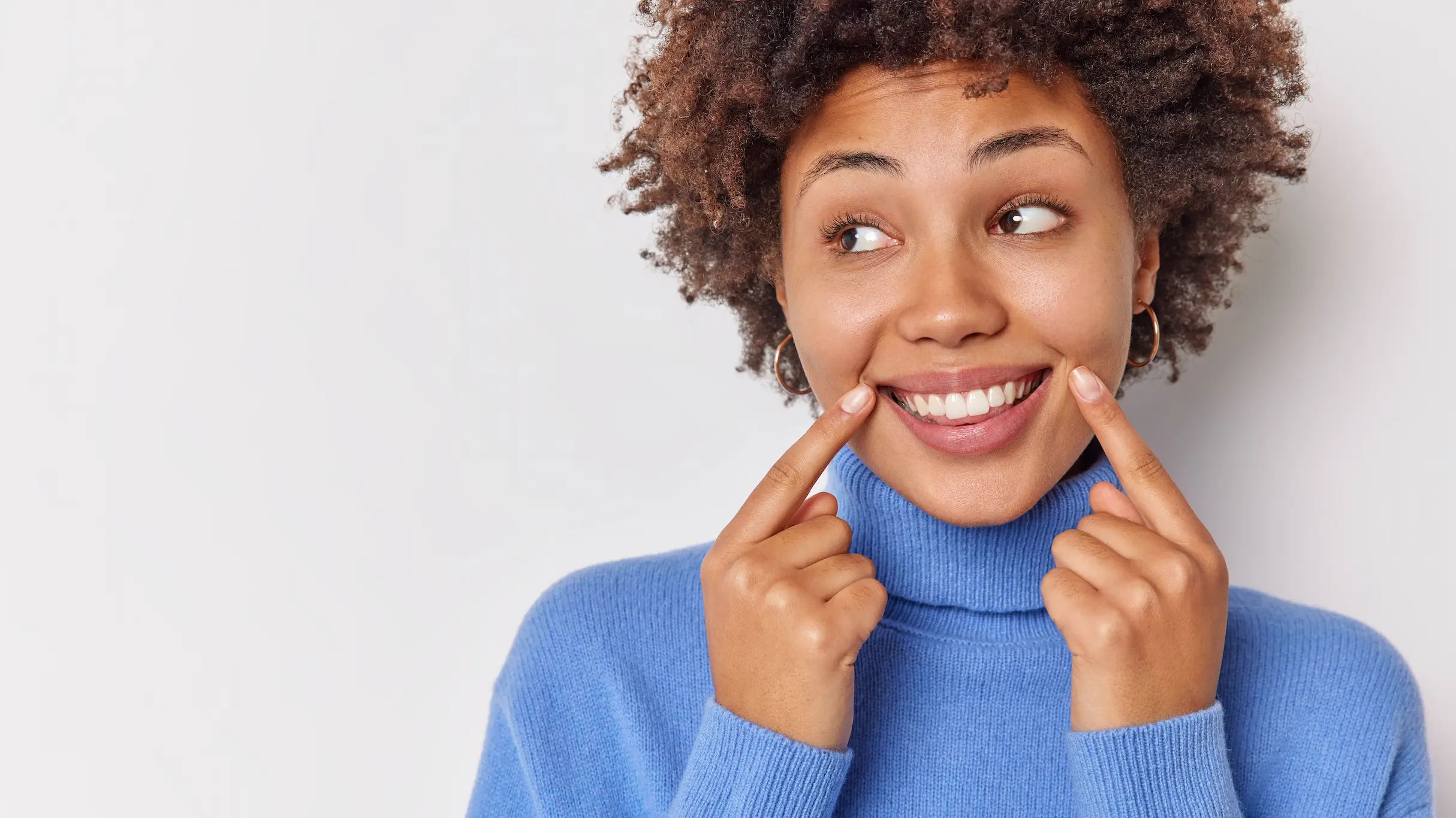 Woman smiling with veneers in Sugar Land, TX